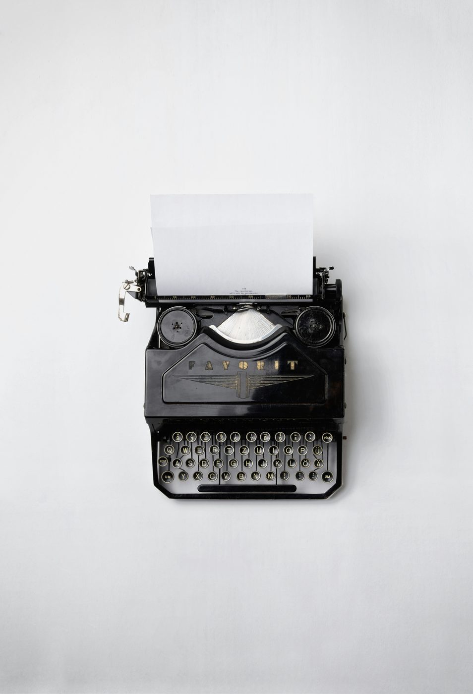 Vintage typewriter on white background.
